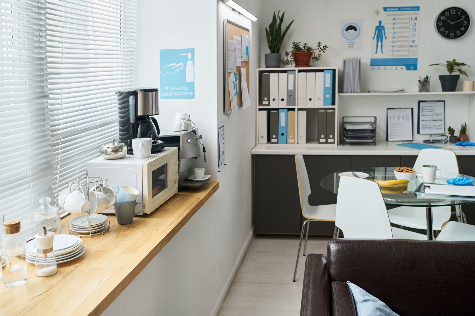 Modern Office Kitchen Featuring Various Appliances and Decor